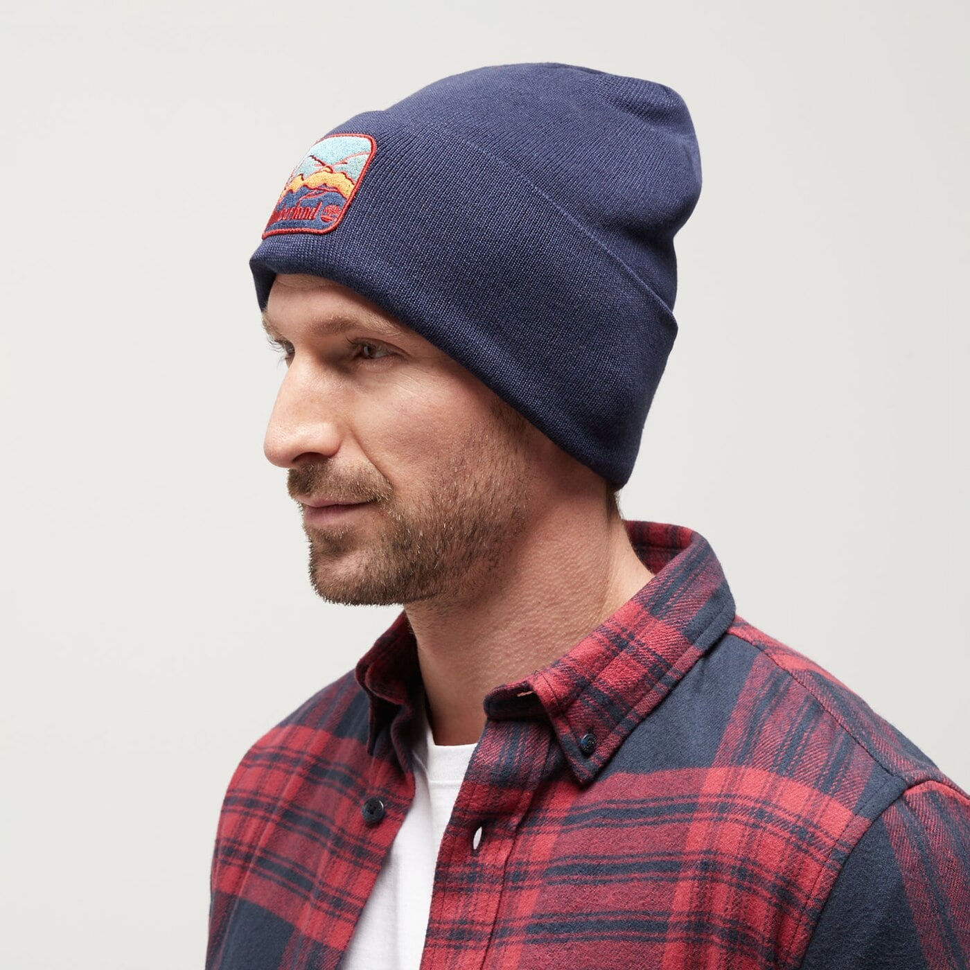 Damska czapka zimowa TIMBERLAND CZAPKA BEANIE WITH MOUNTAIN PATCH tb0a2pnj4511 kolor granatowy