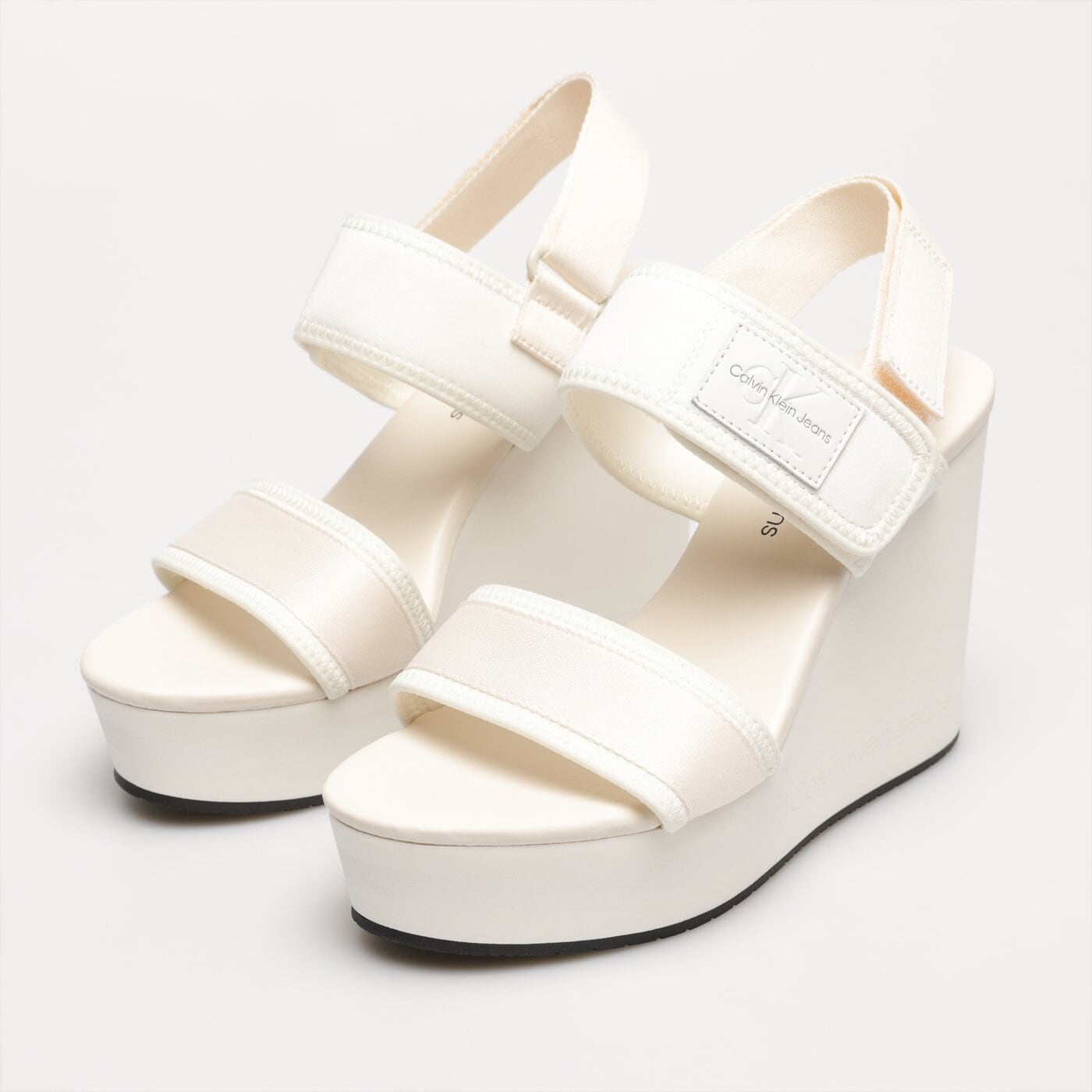 Damskie szpilki / czółenka CALVIN KLEIN WEDGE SANDAL BADGE yw0yw010280la kolor biały